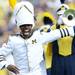 Michigan Marching Band Drum Major Jeffrey Okala, of Belleville, takes the field during the pre game show at Michigan Stadium on Saturday, August 31, 2013. Melanie Maxwell | AnnArbor.com